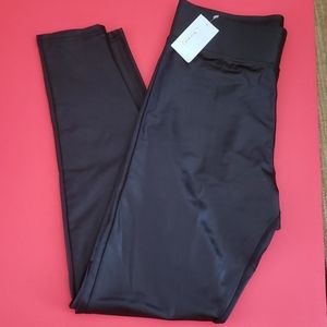 Shiny black pants. Size M